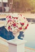 Colorful decoration artificial flower with vintage toned. photo