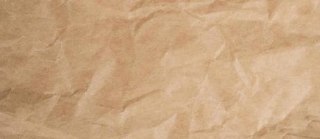 Close up crumpled brown paper texture and background with copy space photo