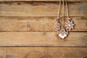 christmas decoration hanging on wood background with space. photo