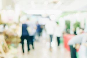 Abstract background blurred image crowd people in shopping mall photo