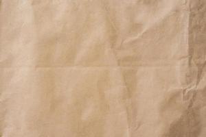 Brown paper crumpled texture and background with space. photo