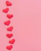 Red heart on pink pastel color background with space for text. photo