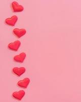 Red heart on pink pastel color background with space for text. photo