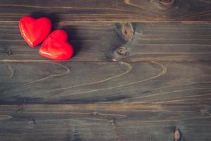 two red heart on wood table background with copy space photo