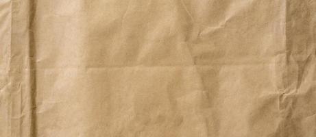 crumpled brown paper background and texture with copy  space. photo