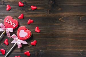 Valentines day heart shaped cookies on wooden table background with copy space. photo