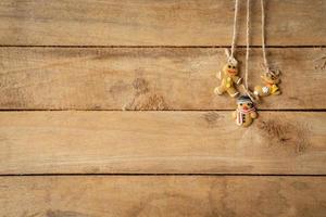 christmas decoration hanging on wood background with space. photo