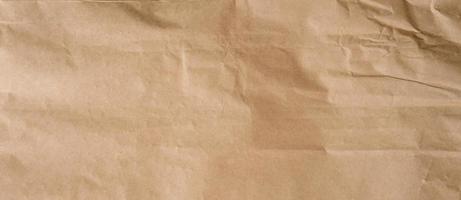 crumpled brown paper background and texture with copy  space. photo