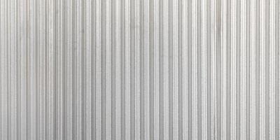 The corrugated grey metal panorama wall background. Rusty zinc grunge texture and background. photo