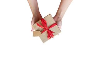 Close up hand woman holding gift box on isolated white with clipping path. photo