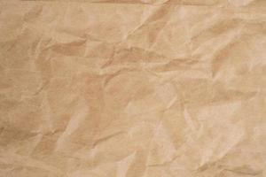 Close up crumpled brown paper texture and background with copy space photo