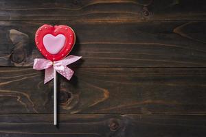 Valentines day heart shaped cookies on wooden table background with copy space. photo