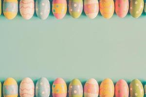 Coloeful easter eggs on pastel color background with space. photo