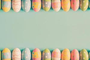 Coloeful easter eggs on pastel color background with space. photo