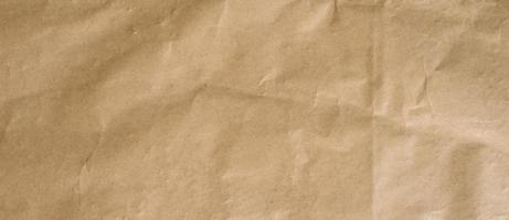 crumpled brown paper background and texture with copy  space. photo