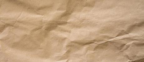 crumpled brown paper background and texture with copy  space. photo