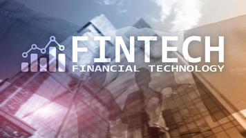 FINTECH - Financial technology, global business and information Internet communication technology. Skyscrapers background. Hi-tech business concept photo