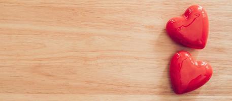 Top view red heart on wood table background with copy space. photo