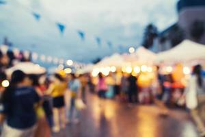 Abstract blur background in night market at shopping mall for background, Vintage toned. photo