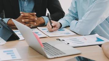 Financial analysts analyze business financial reports on a digital tablet planning investment project during a discussion at a meeting of corporate showing the results of their successful teamwork. video