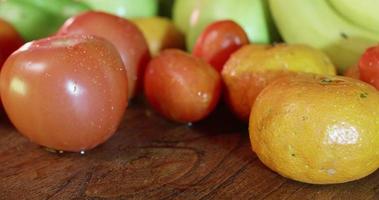 Summer fruits on a wooden table video