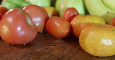 Summer fruits on a wooden table video