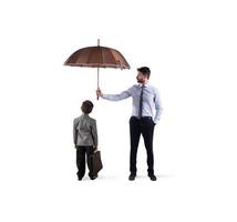 Businessman with umbrella that protect a child. Concept of young economy and startup protection photo