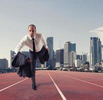 Businessman acts like a runner. Competition and challenge in business concept photo