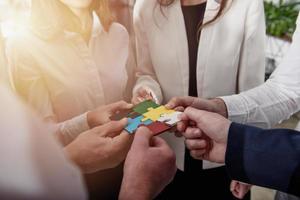Teamwork of partners. Concept of integration and startup with puzzle pieces. photo