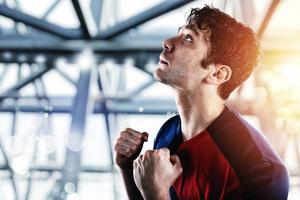 Football fan at the stadium with victory gesture photo