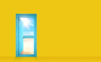 Door into a yellow wall that opens onto the beach photo