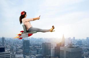 Woman drives fast with rockets under the chair. concept of having the turbo photo