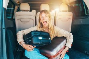 Woman is ready to travel with baggages in hand photo