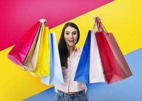 Happy woman with shopping bags in hand. photo