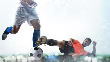 Close up of a football action scene with competing soccer players on white background photo