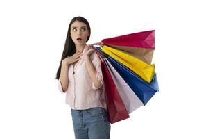 Happy woman with surprised expression and shopping bags. Isolated on white background photo