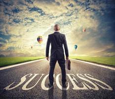 Man walks on a success way. Concept of successful businessman and company startup photo