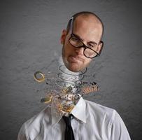 Stress and overwork concept. Explosion of a head of a businessman photo