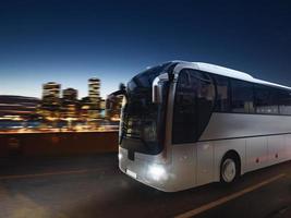 Bus on the road at night with city landscape. 3D rendering photo