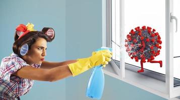 Funny housewife cleans and disinfects to keep virus away photo