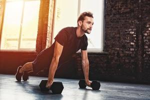 Man doing pushups at the gym photo