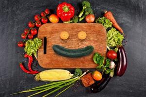 Healthy background of vegetable with a shape of smile. Concept of genuine food photo