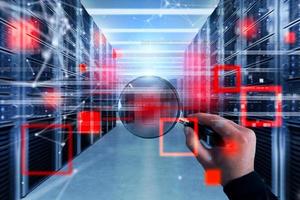 Hacker with magnifier lens try to read illegally protected information stored on server photo
