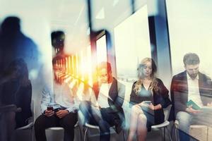 Young candidates waiting for an interview for a job. Concept of recruitment ad career. Double exposure effects with a glass window photo