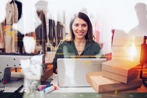 Seamstress works to new clothes ordered by internet client photo