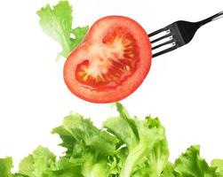 Background of mixed salad with a fork photo