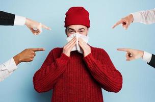 Boy caught a cold is accused of infecting the virus. Studio on Cyan background photo