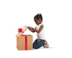 Happy little girl with a Christmas gift photo