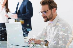 Businessman in office connected on internet network. concept of startup company photo