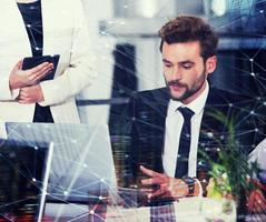 Businessperson in office connected on internet network. concept of partnership and teamwork photo